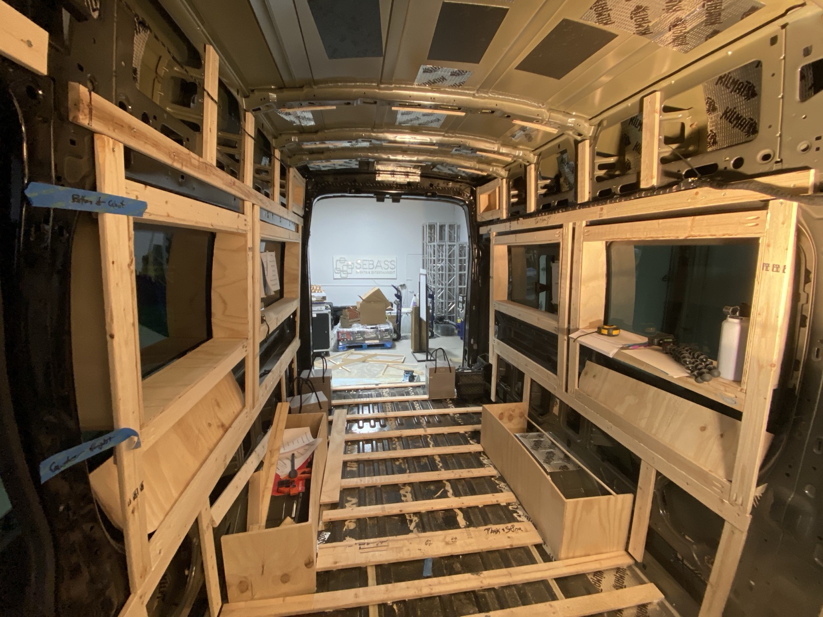The bare Transit with its first wood framing and floor battens in place