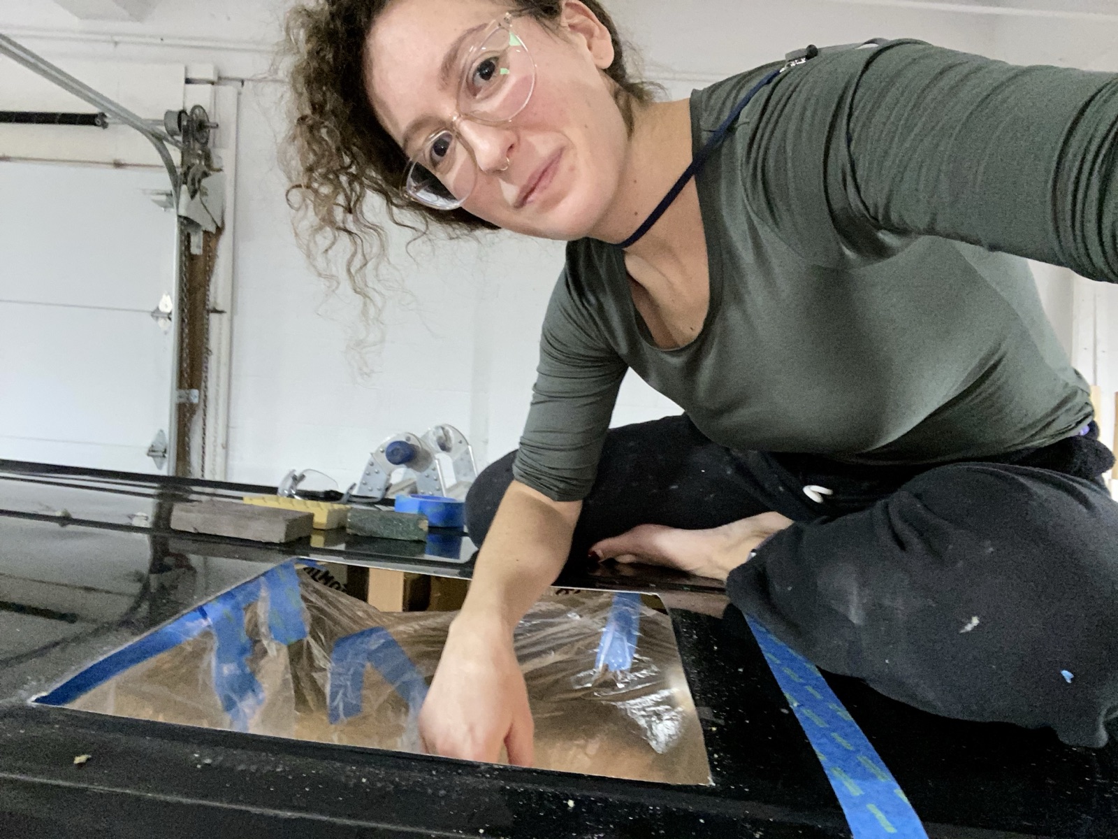 Cristina working on a panel on the workshop floor
