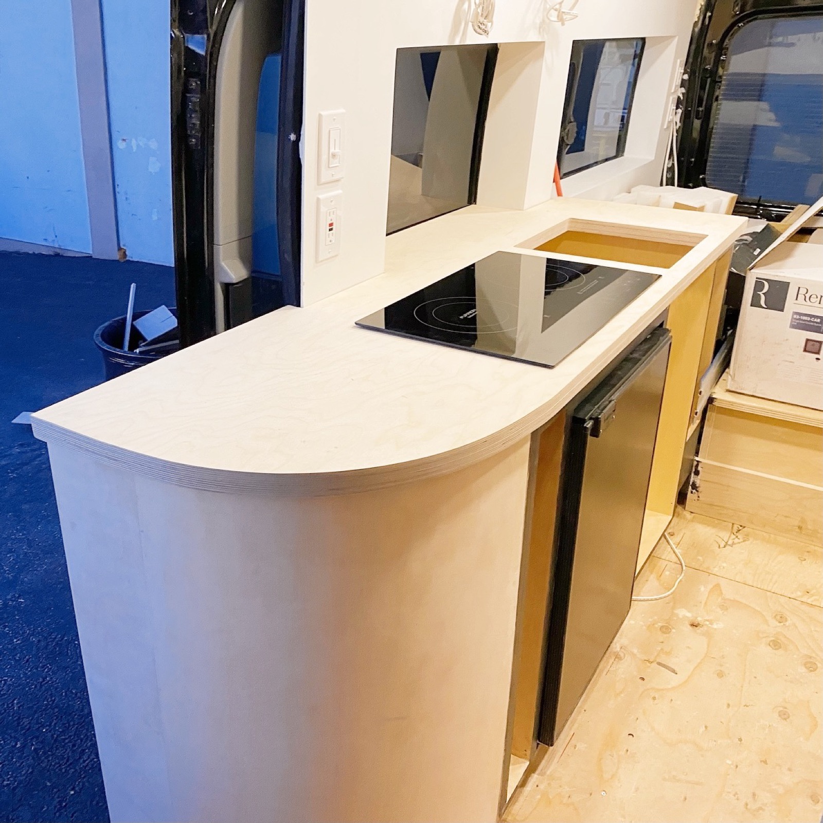 The finished curved kitchen counter with induction cooktop