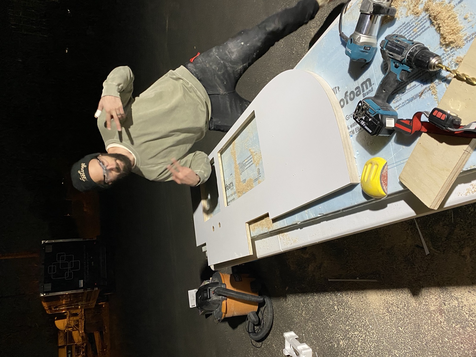Mark hamming it up at night beside the countertop on sawhorses